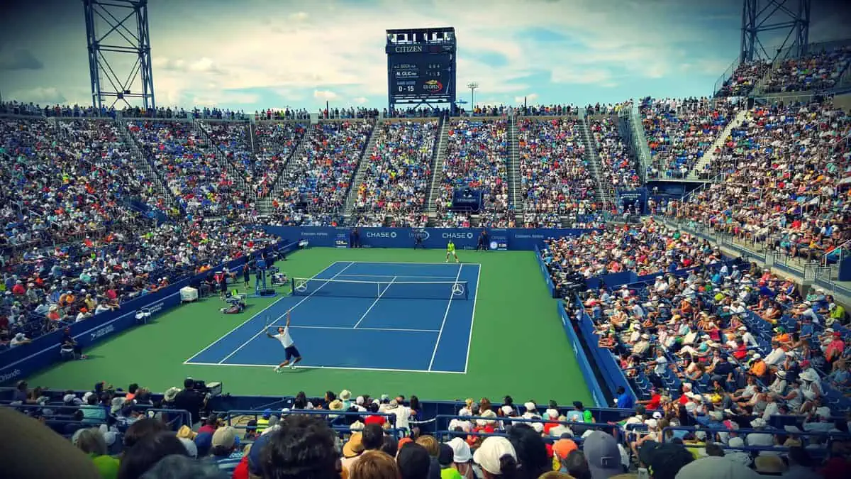 people sitting on bench watching tennis event on field 171568 scaled Summit Prep